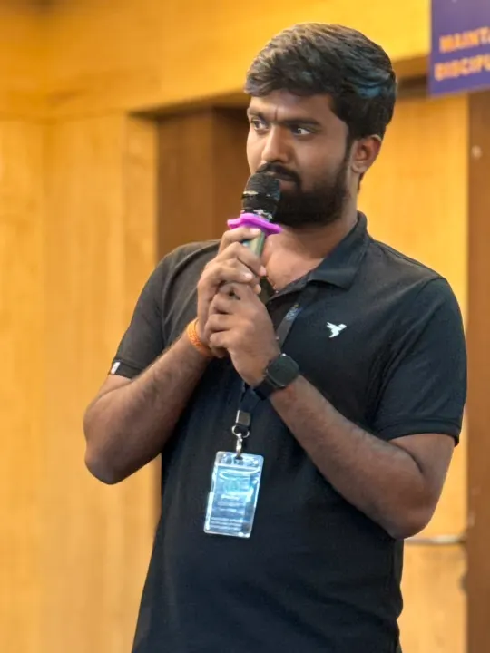 A team member speaking into a microphone