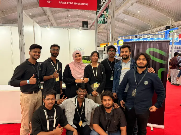 The team posing together at an exhibition