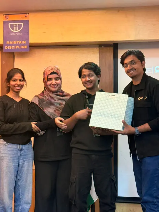 Team members holding up a certificate