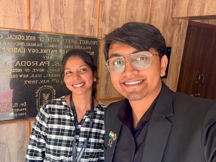 Two team members smiling together